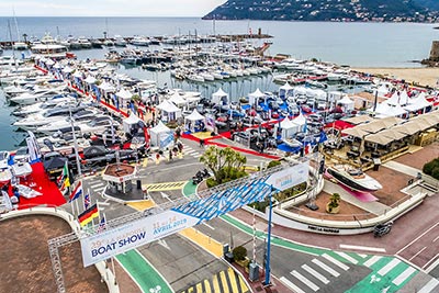 Entrance of the Port La NApoule during boat show with flags and stands