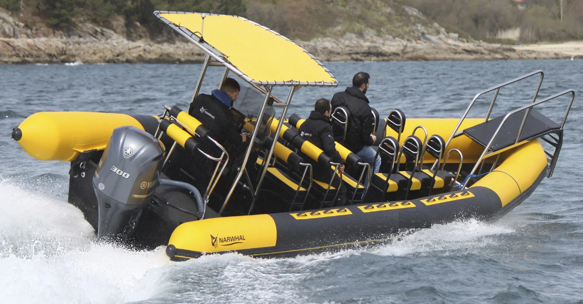 Black and yellow rib boat with T-top for navigation